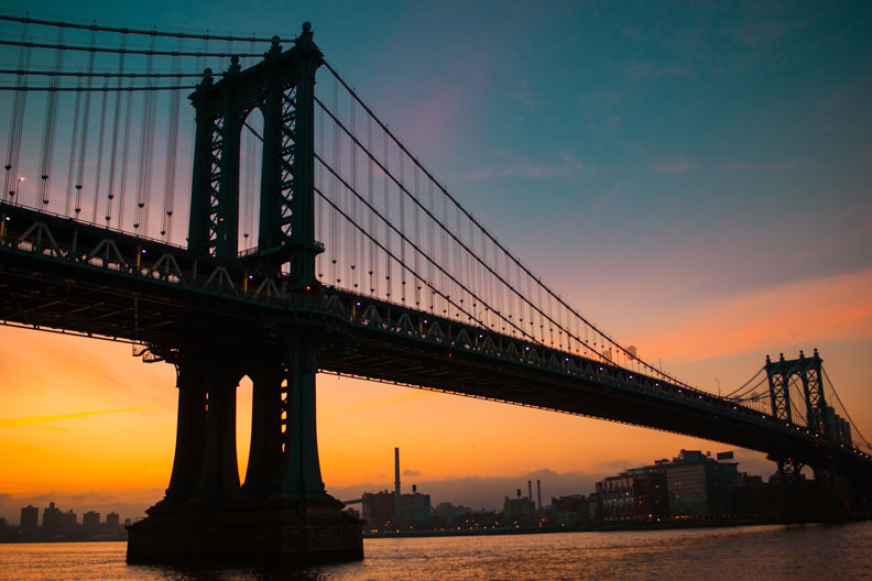 Brooklyn Bridge with blue yellow sunset