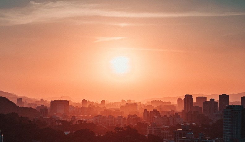 A warm sunset over a city skyline